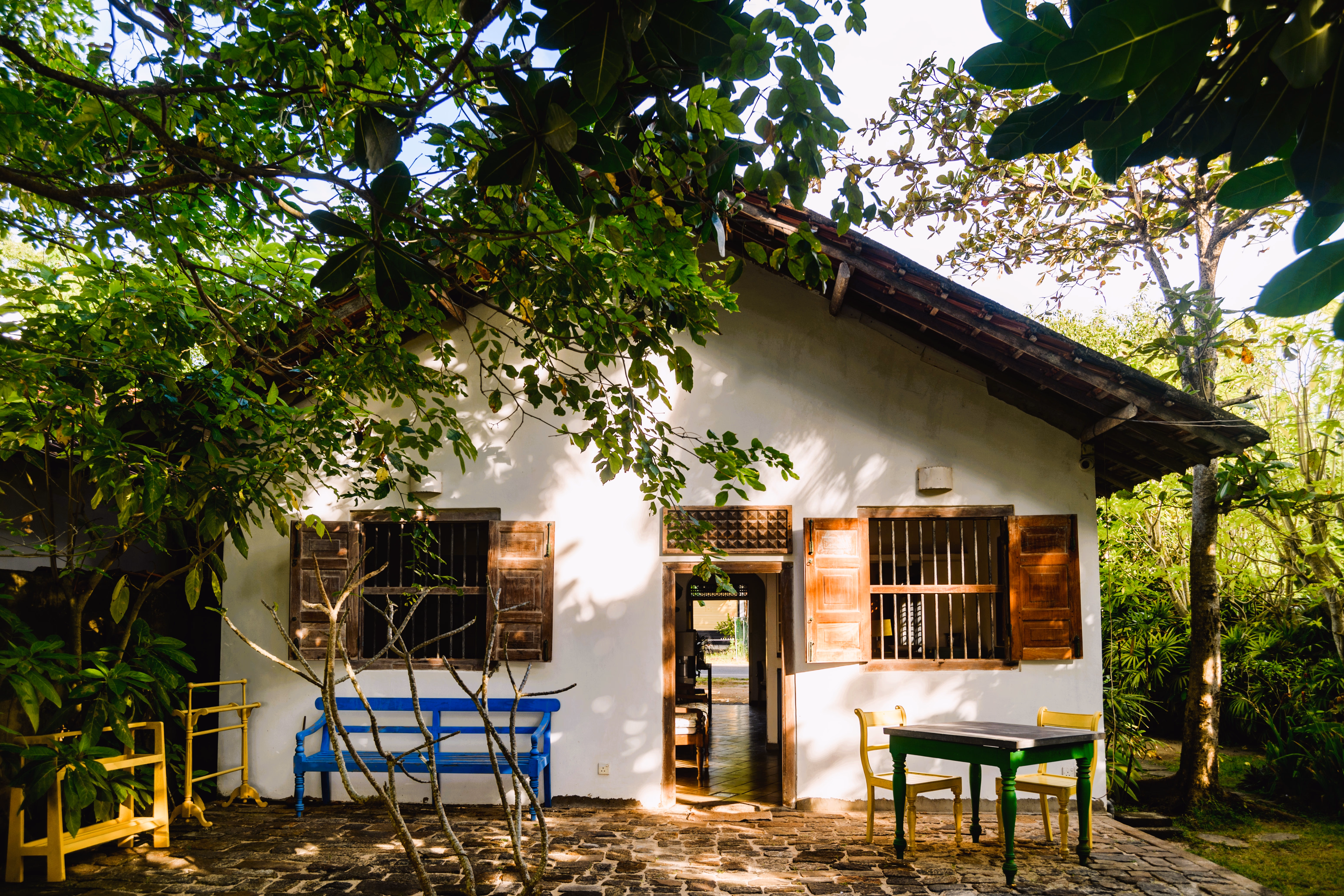 A cozy and well-lit bedroom at Magnolia House.