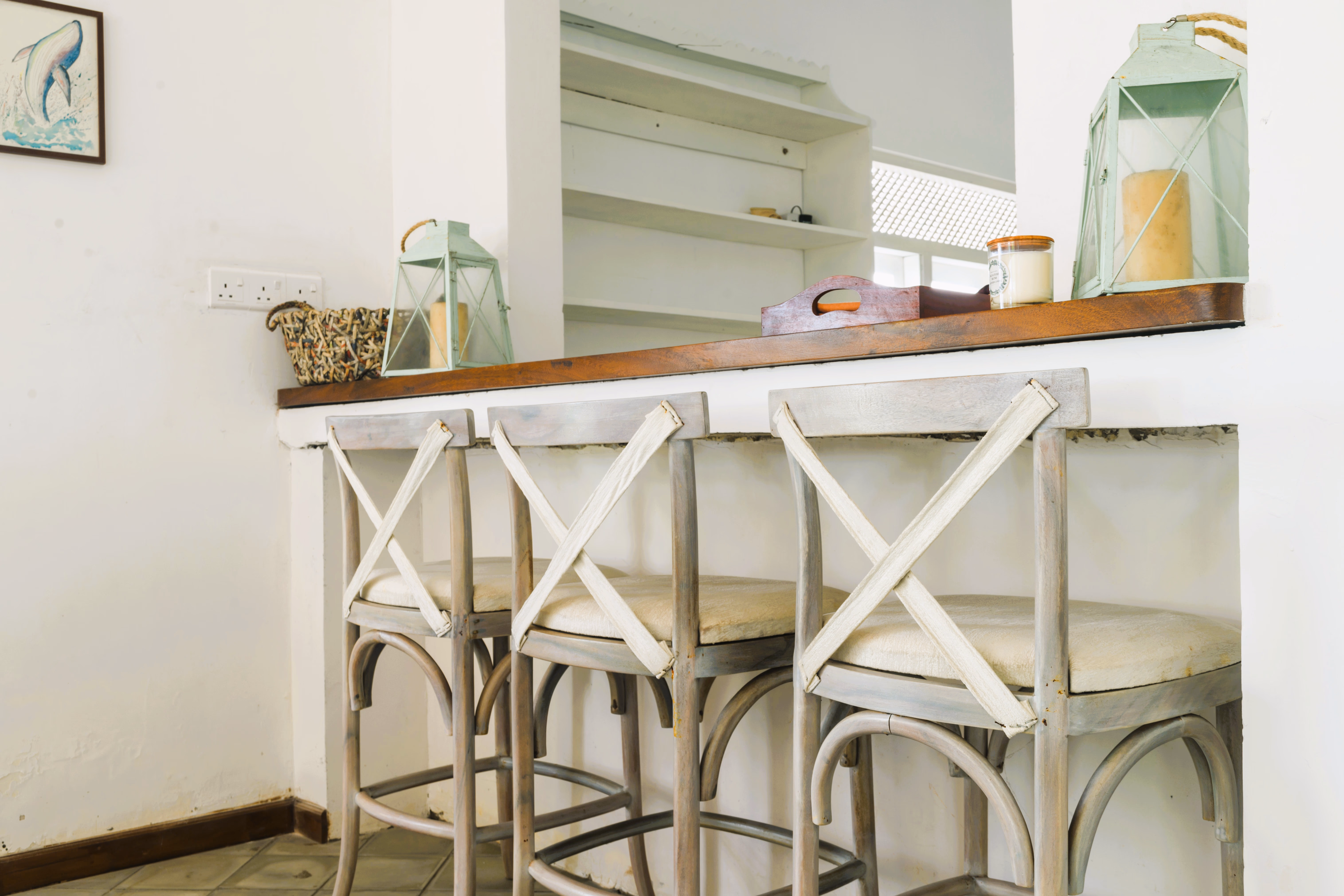 Bright and airy bedroom with a view of the outdoors.